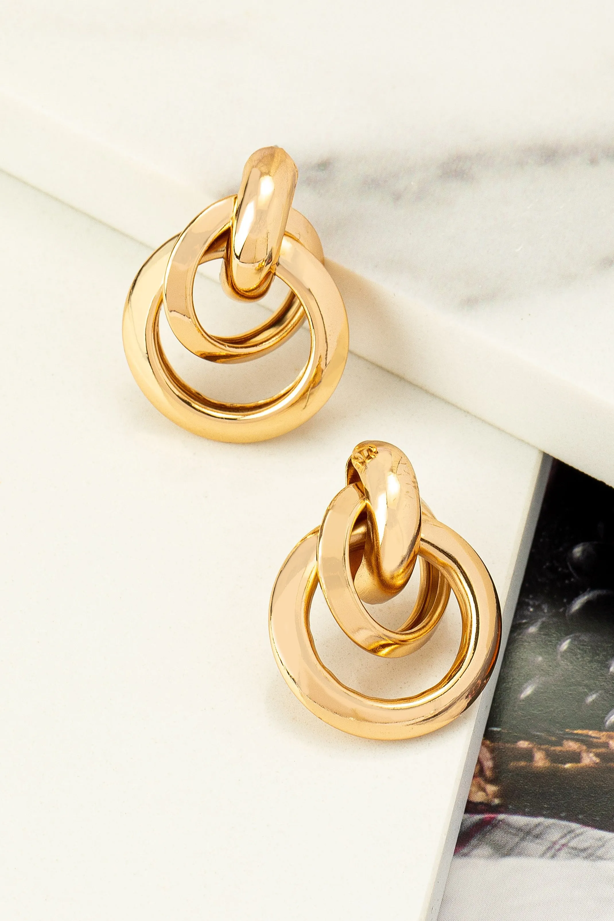 Intertwined small puffy hoop earrings